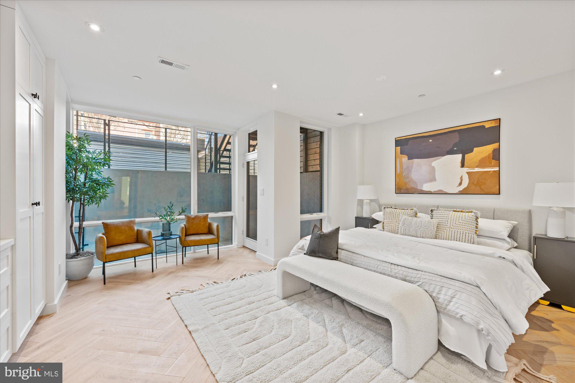 1319 R Street Northwest, Unit 2100 Washington, DC 20009 - Photo 21 of 36 a bedroom with a bed and a couch