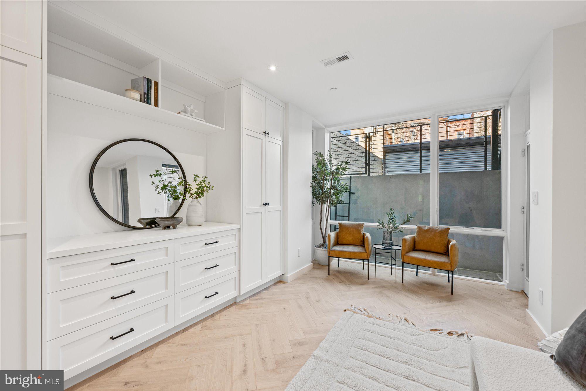 1319 R Street Northwest, Unit 2100 Washington, DC 20009 - Photo 23 of 36 a living room with furniture and a mirror