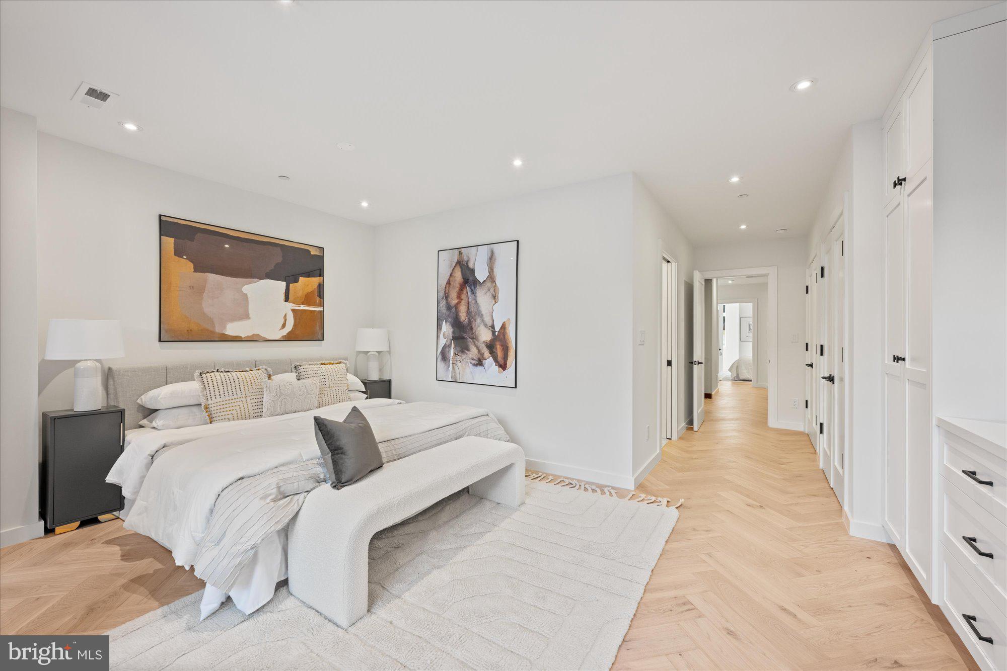 1319 R Street Northwest, Unit 2100 Washington, DC 20009 - Photo 24 of 36 a spacious bedroom with a bed and a couch