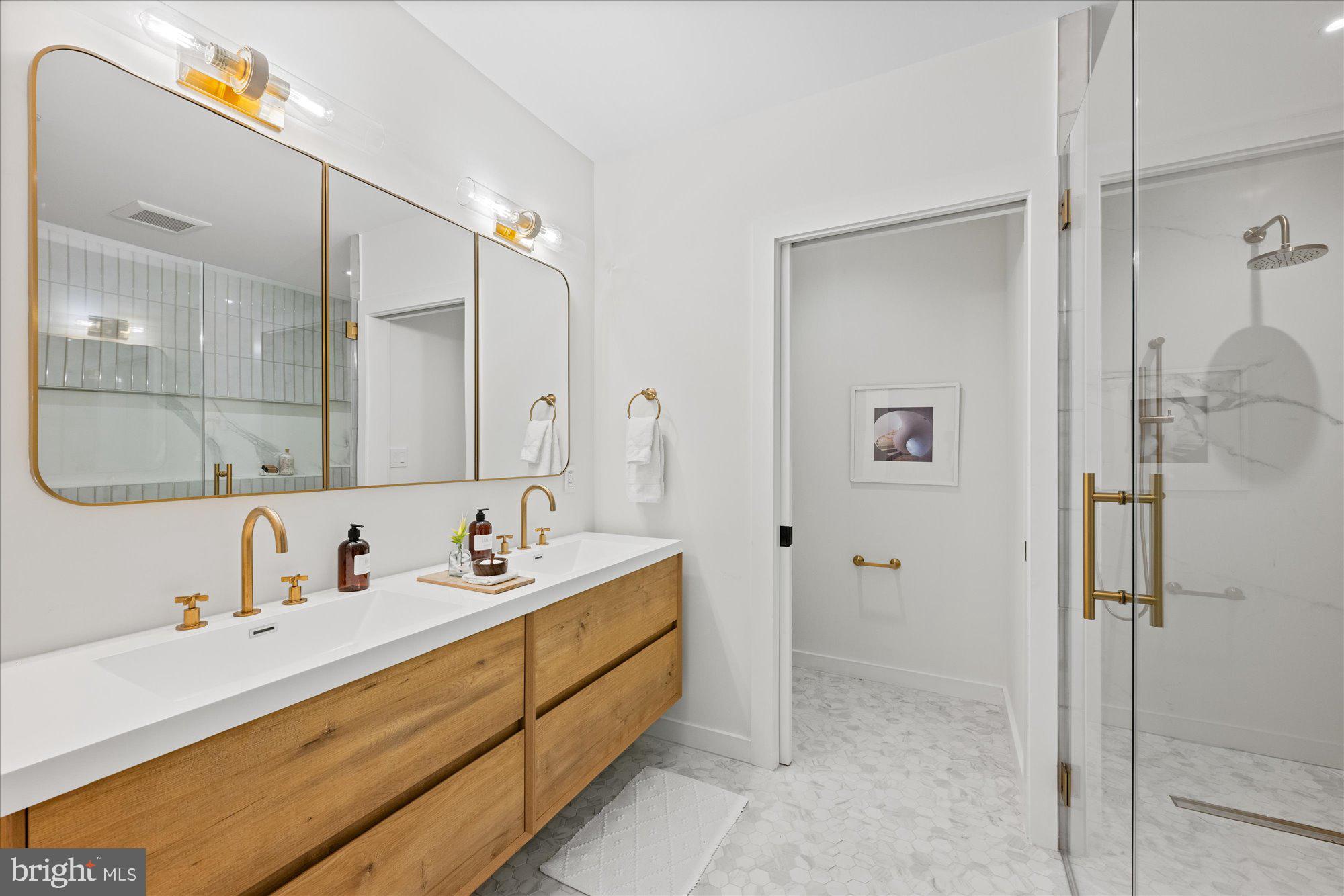 1319 R Street Northwest, Unit 2100 Washington, DC 20009 - Photo 26 of 36 a bathroom with a sink and a mirror