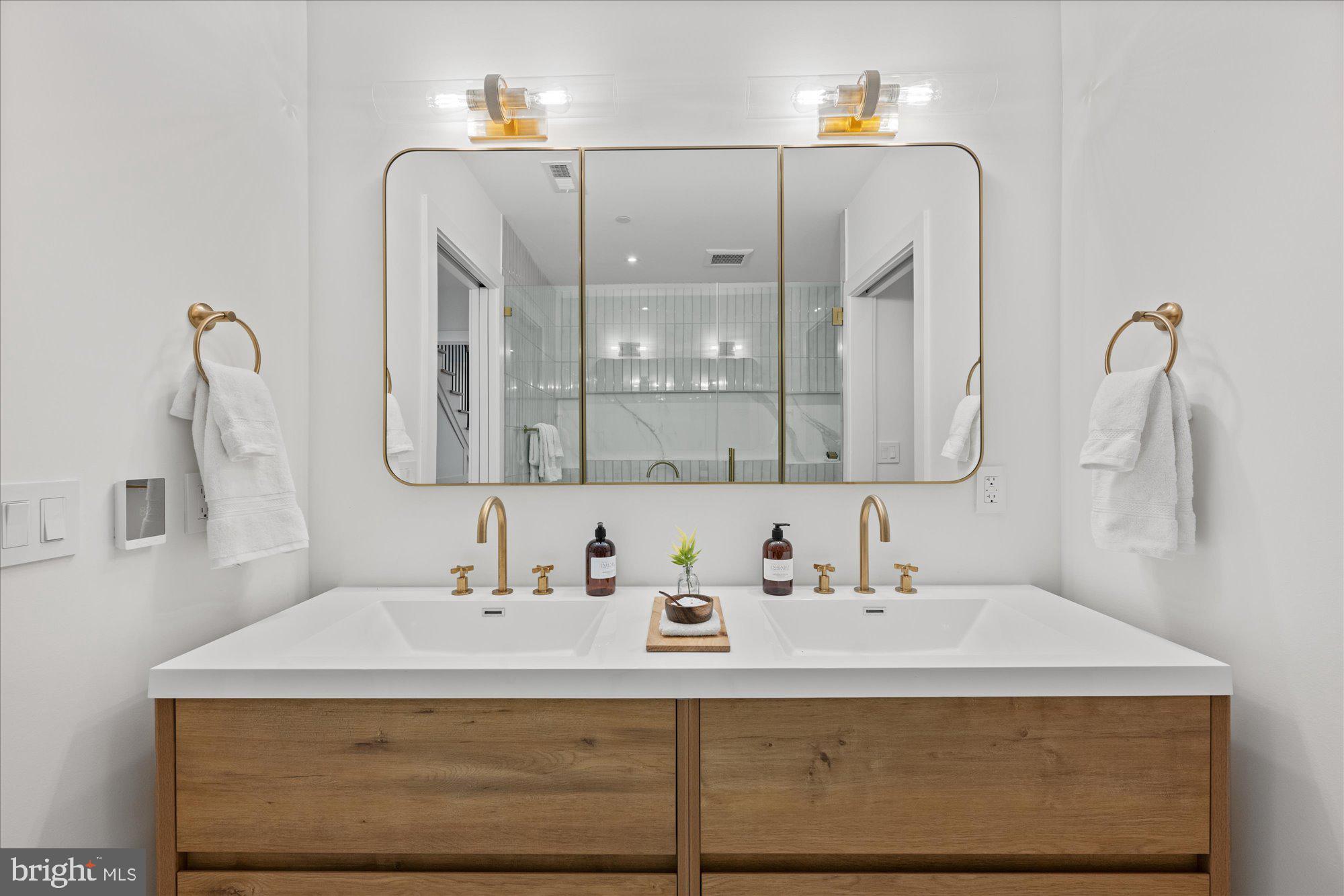 1319 R Street Northwest, Unit 2100 Washington, DC 20009 - Photo 27 of 36 a bathroom with a sink and a mirror