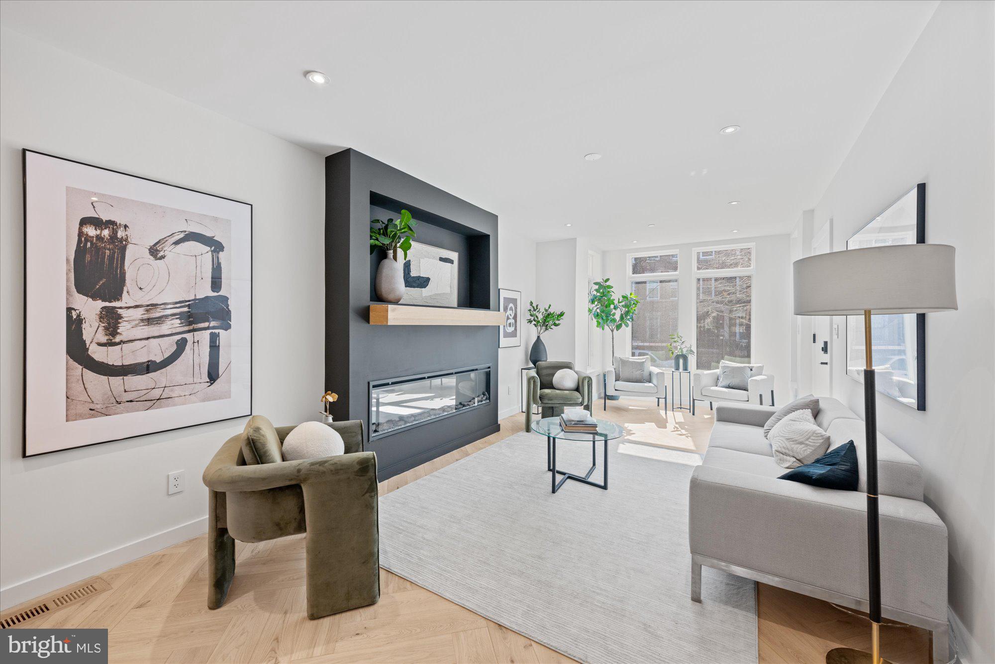 1319 R Street Northwest, Unit 2100 Washington, DC 20009 - Photo 5 of 36 a living room with furniture and a fireplace