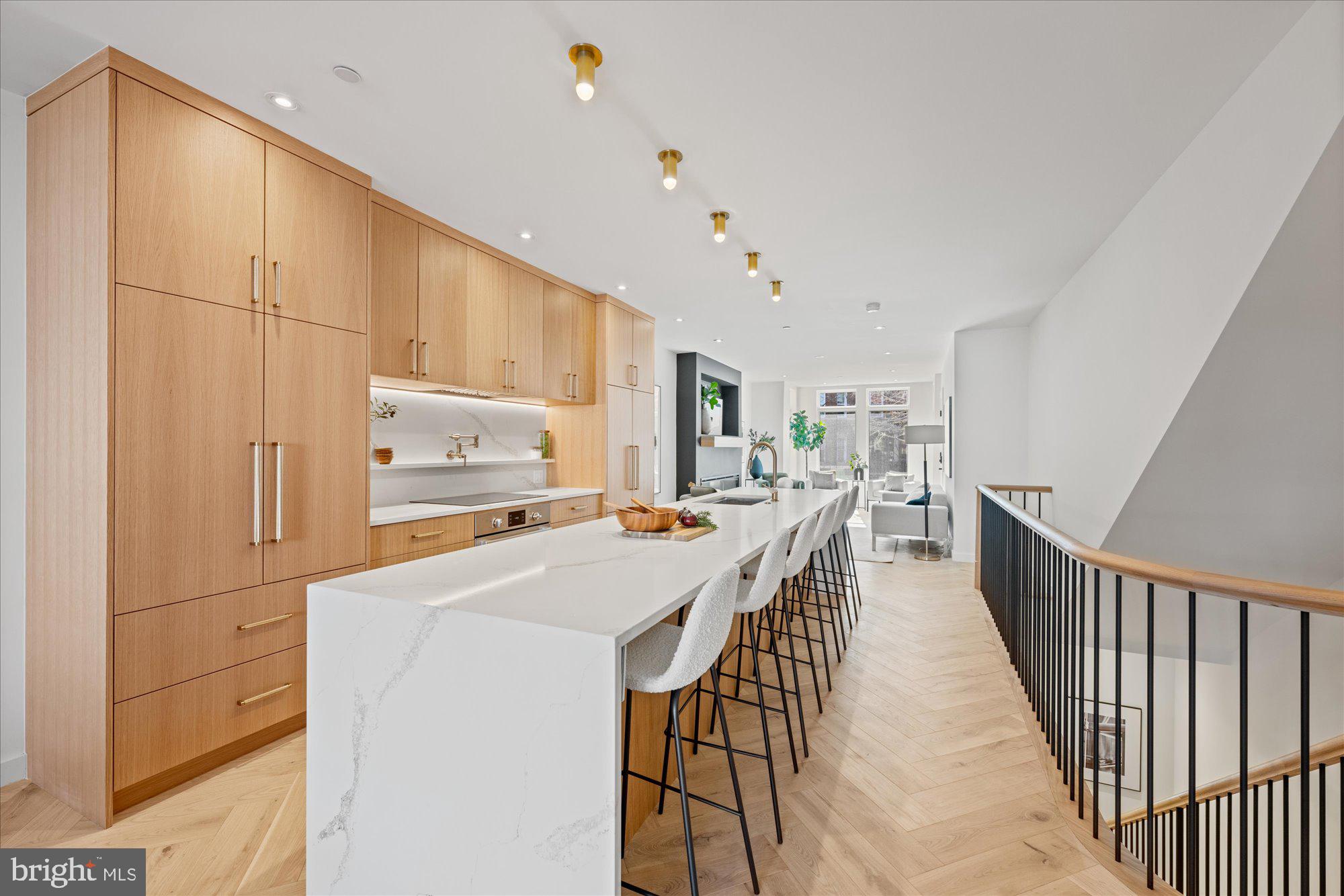 1319 R Street Northwest, Unit 2100 Washington, DC 20009 - Photo 10 of 36 a kitchen with counter top space and cabinets