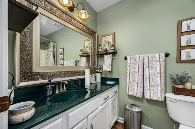 a bathroom with a white tub and shower