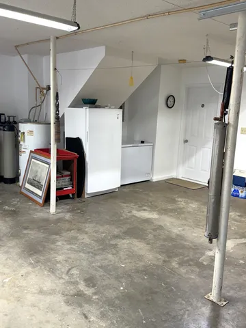 a view of a roof deck with table and chairs with wooden floor and fence
