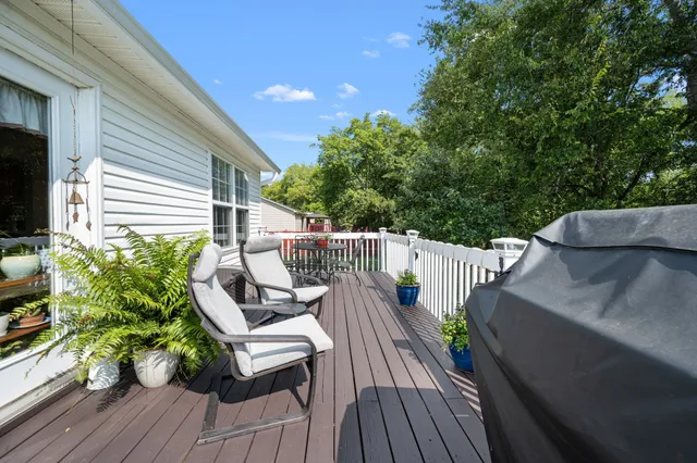 a swimming pool with wooden fence