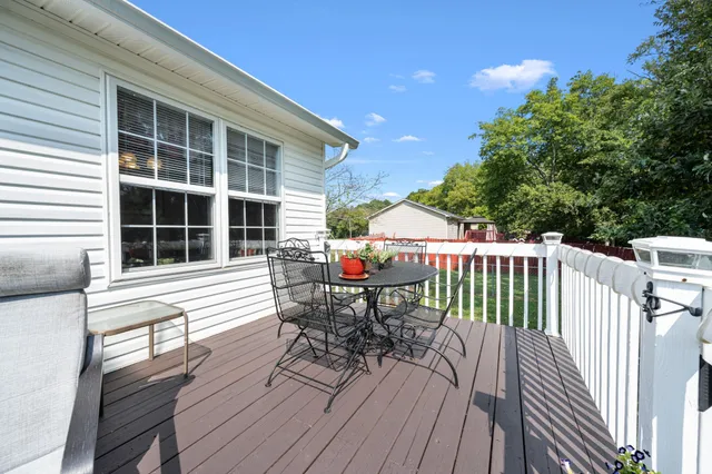 a view of a house with a yard and garage