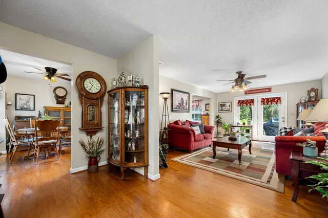 a view of a livingroom with furniture and a large window