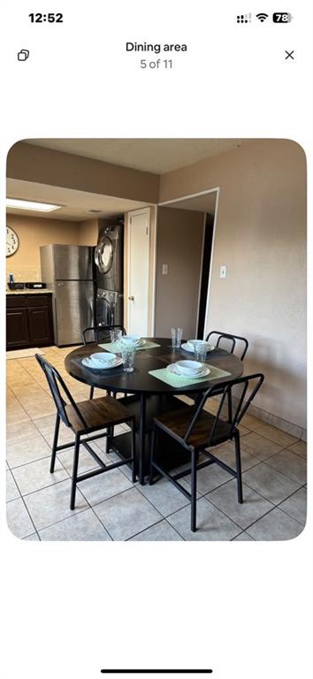 5615 Harvest Hill Road, Unit 2015 Dallas, TX 75230 - Photo 3 of 9 a living room with table and chairs
