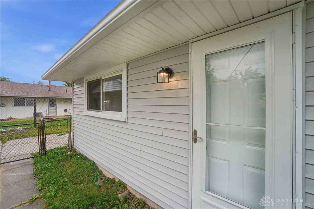 1923 Portage Path Springfield, OH 45506 - Photo 35 of 40 A durable storm door and classic outdoor lighting welcome guests to this inviting exterior.