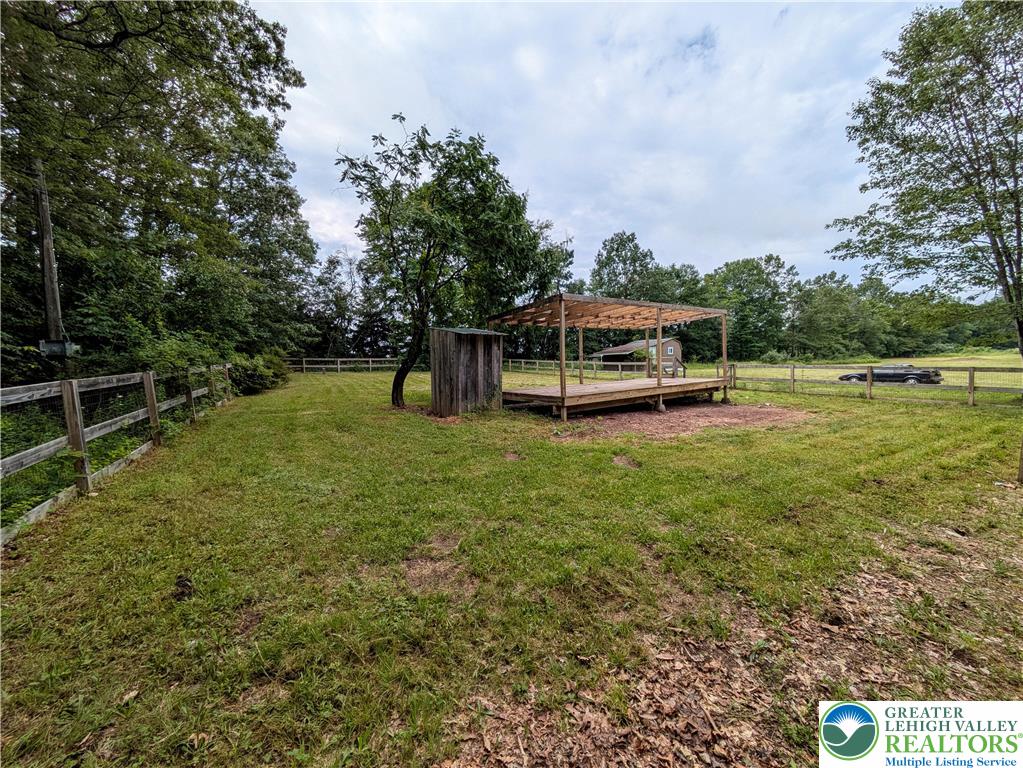 223 Brink Road Saylorsburg, PA 18353 - Photo 7 of 19 a view of a green field with trees in the background