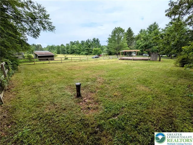 a view of a lake with a yard