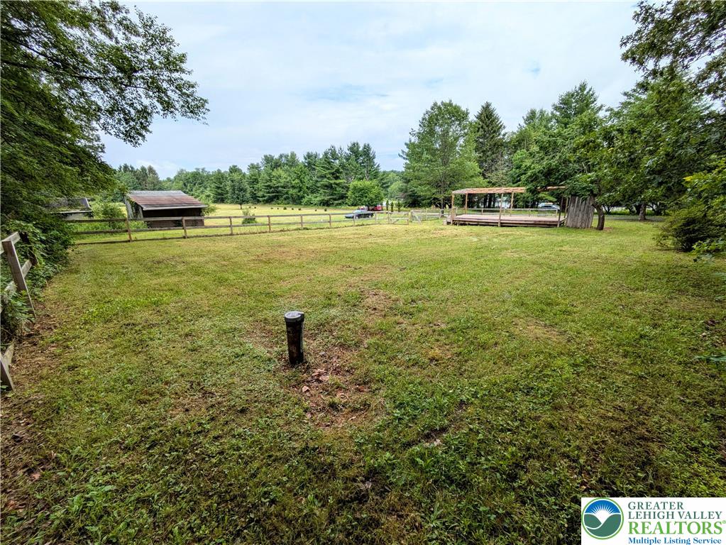 223 Brink Road Saylorsburg, PA 18353 - Photo 8 of 19 a view of a lake with a yard