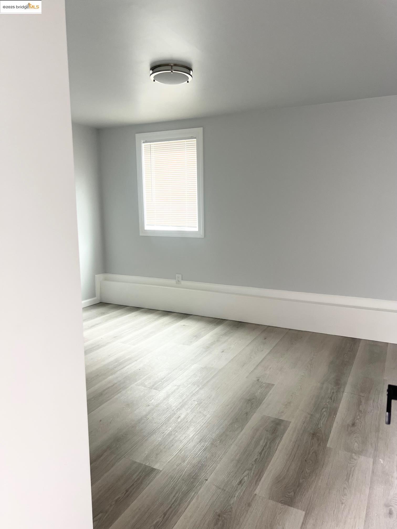 2501 Mabel Street, Unit B Berkeley, CA 94702 - Photo 5 of 7 an empty room with a window