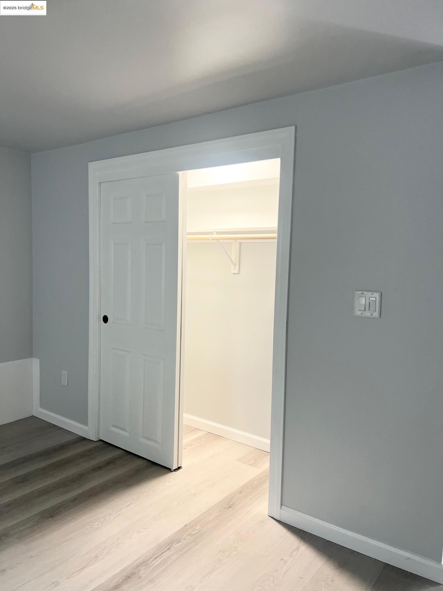 2501 Mabel Street, Unit B Berkeley, CA 94702 - Photo 7 of 7 a view of a hallway with wooden floor