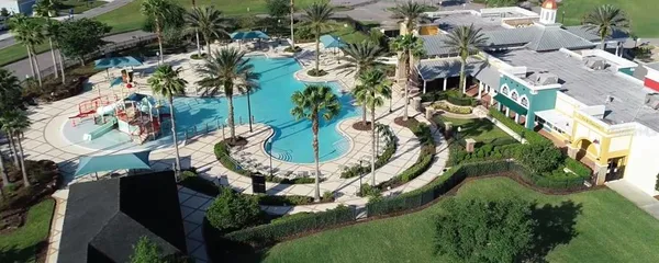an aerial view of residential house with outdoor space and swimming pool