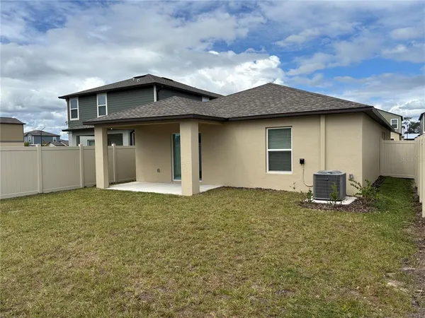 a house with trees in the background