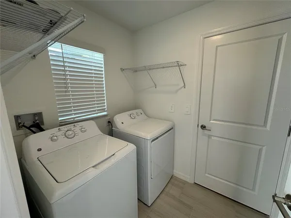 a utility room with dryer and washer