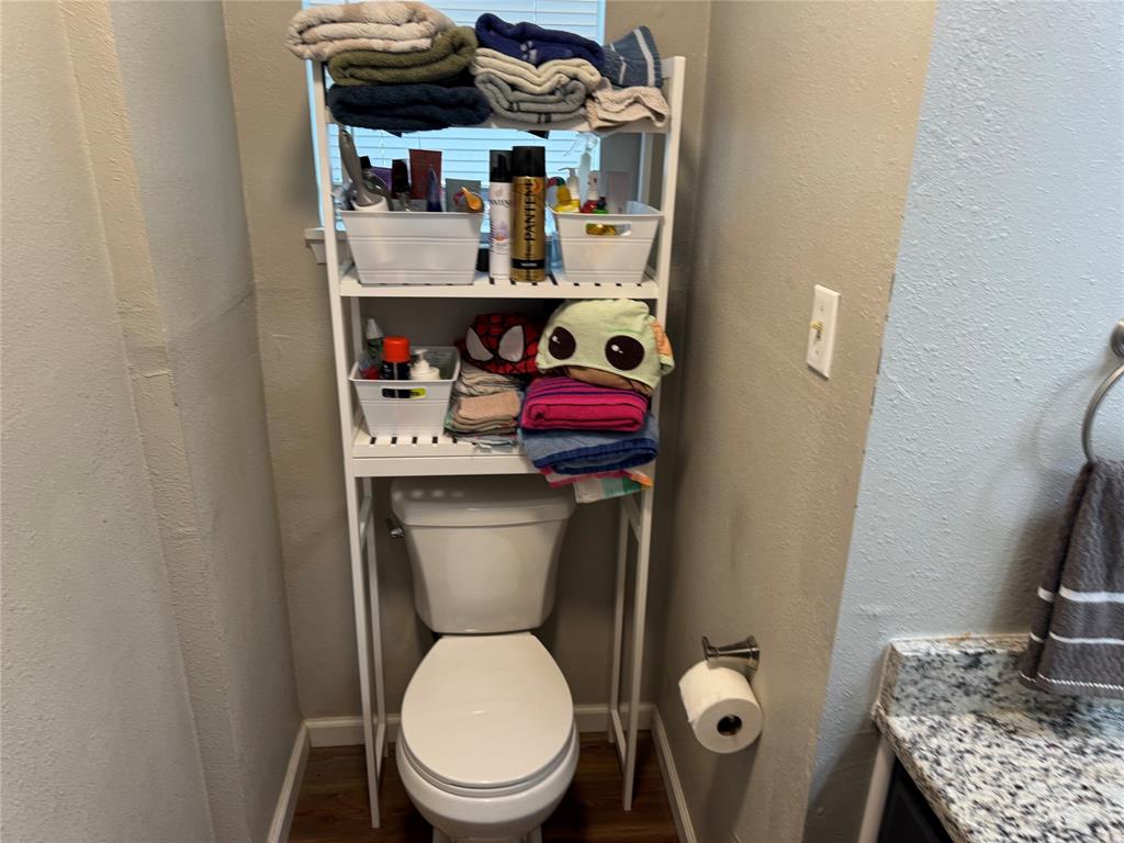 1020 Southeast 10th Street Cooper, TX 75432 - Photo 11 of 11 a bathroom with a toilet and a sink