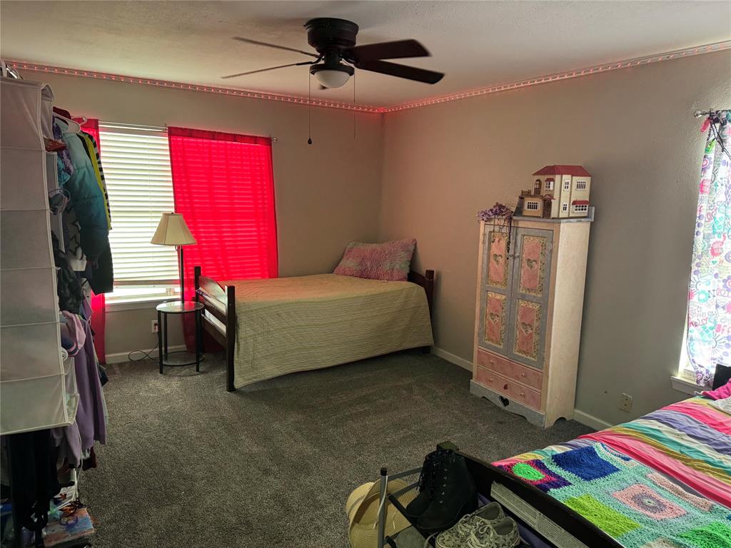 1020 Southeast 10th Street Cooper, TX 75432 - Photo 8 of 11 a bedroom with bed and a window