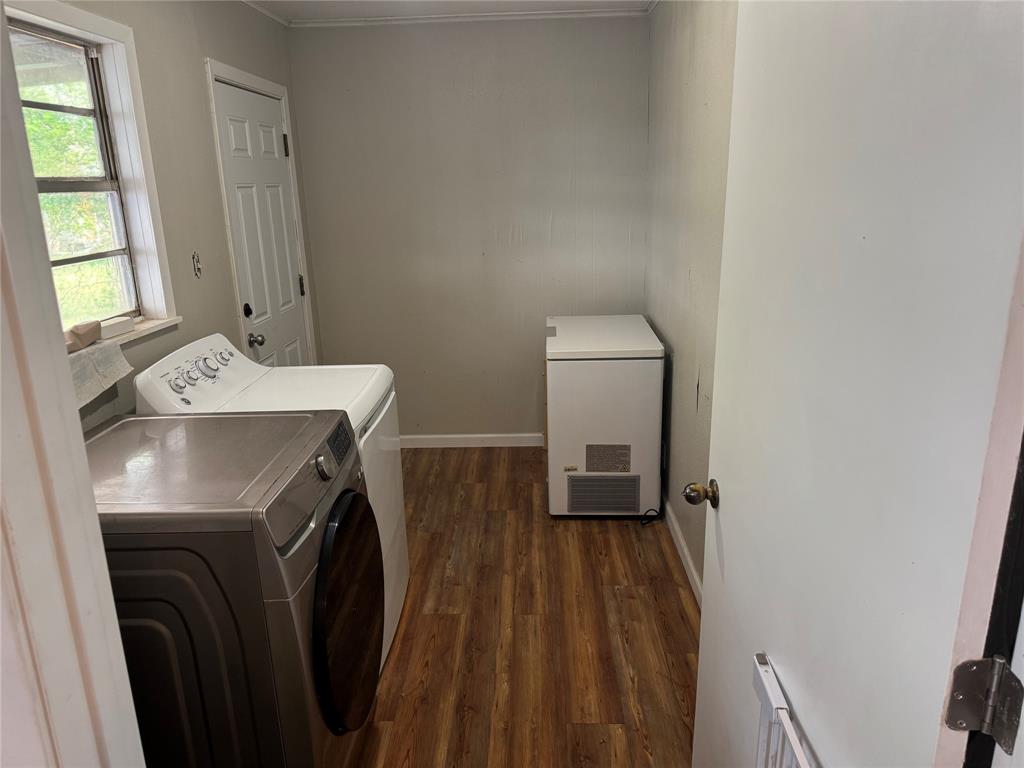 1020 Southeast 10th Street Cooper, TX 75432 - Photo 10 of 11 a utility room with dryer and washer