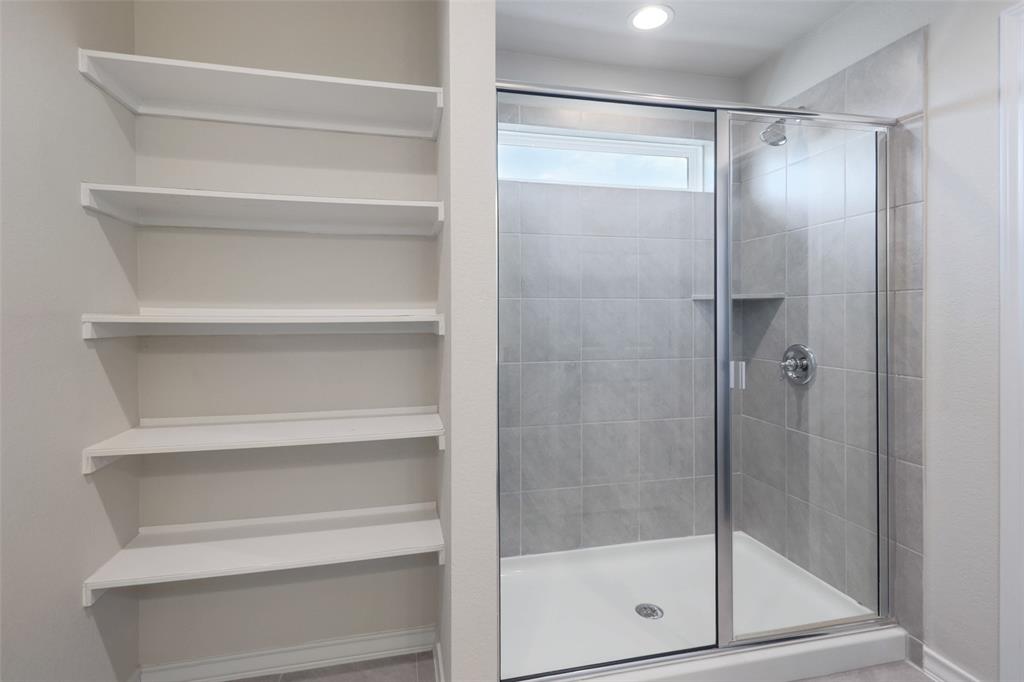 2004 Rinker Ranch Drive Austin, TX 78725 - Photo 15 of 23 a bathroom with a glass shower