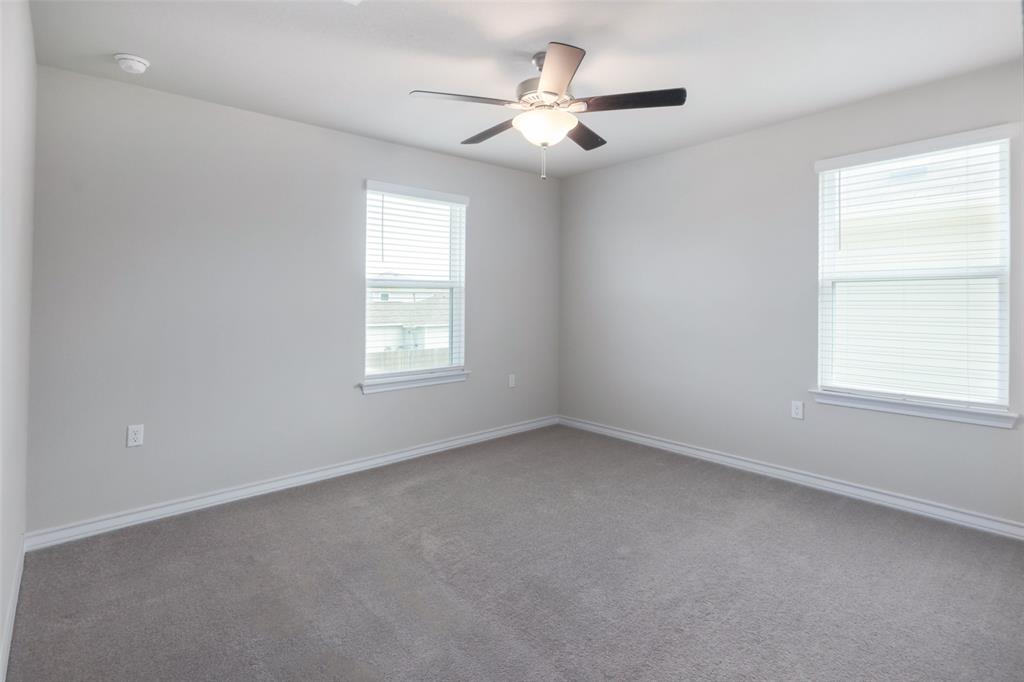 2004 Rinker Ranch Drive Austin, TX 78725 - Photo 18 of 23 an empty room with a window and a fan