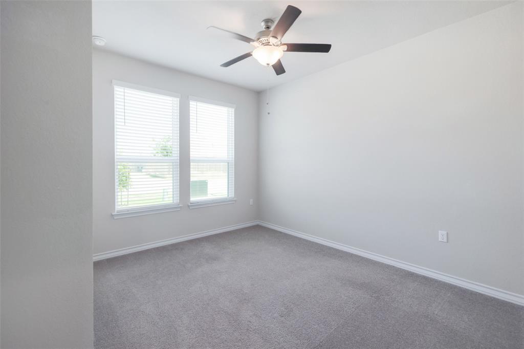 2004 Rinker Ranch Drive Austin, TX 78725 - Photo 19 of 23 an empty room with a window and a fan