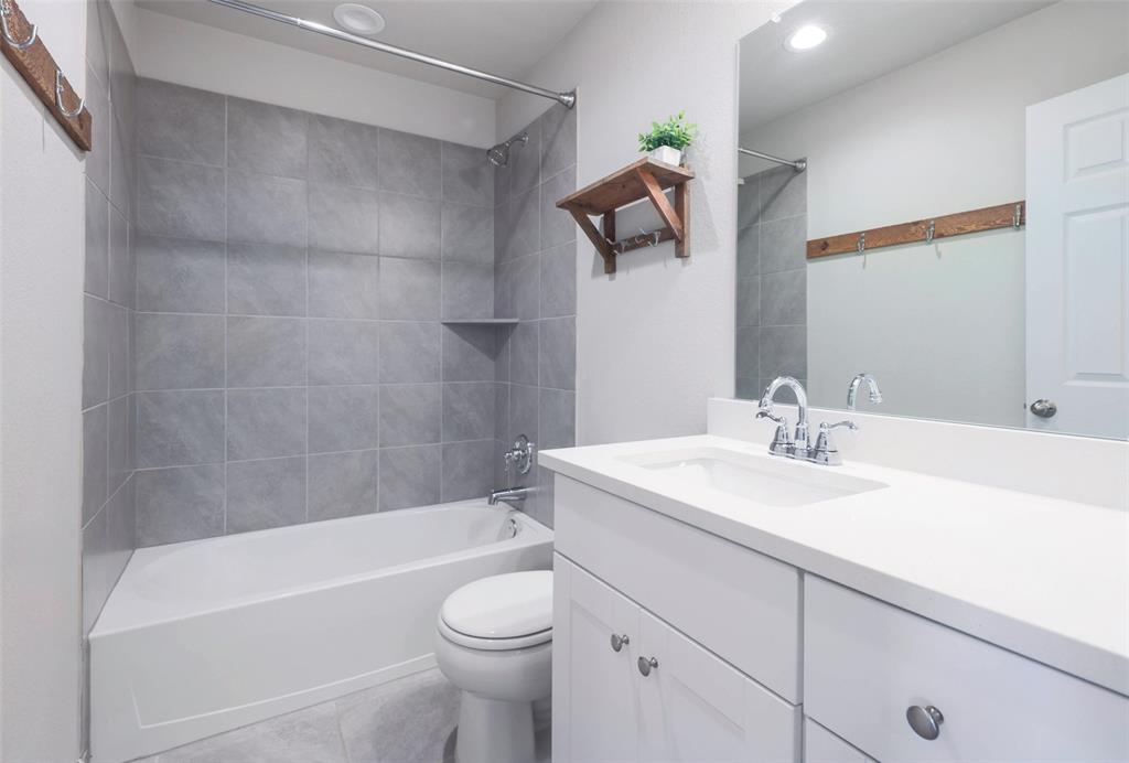 2004 Rinker Ranch Drive Austin, TX 78725 - Photo 20 of 23 a bathroom with a sink a toilet and bathtub