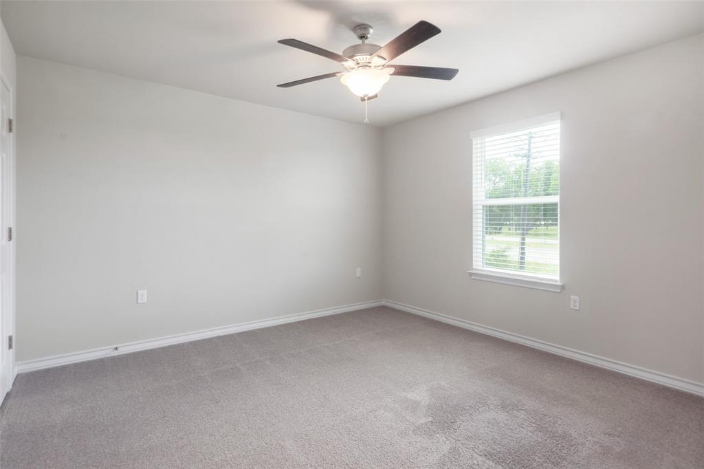 2004 Rinker Ranch Drive Austin, TX 78725 - Photo 6 of 23 an empty room with a window and a fan