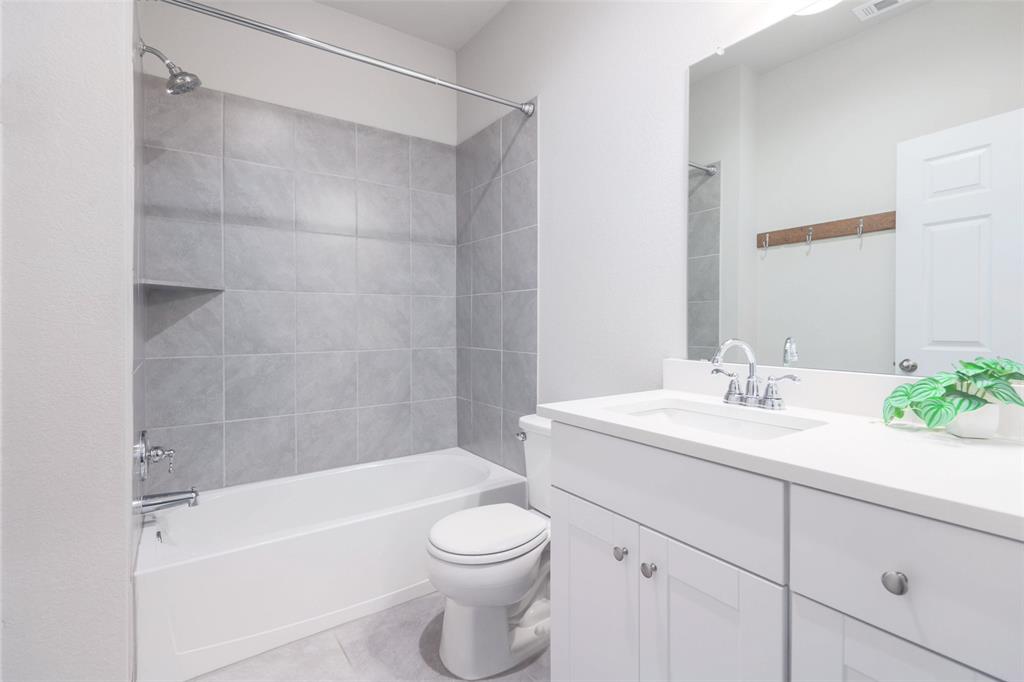 2004 Rinker Ranch Drive Austin, TX 78725 - Photo 8 of 23 a bathroom with a sink a toilet and shower