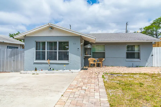 a front view of a house with a outdoor space