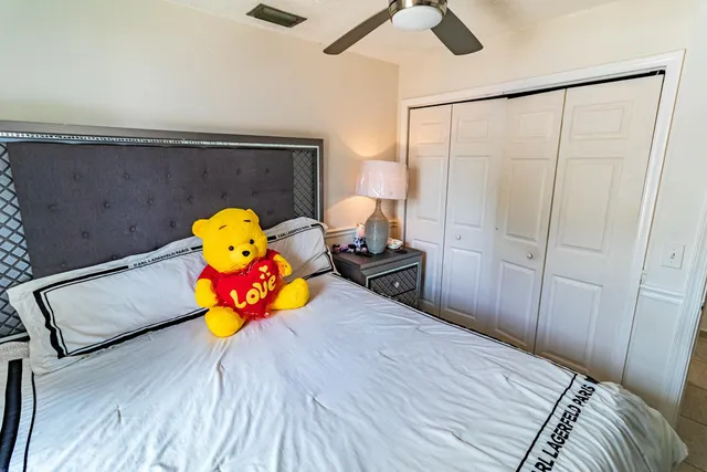 a view of a bedroom with a bed and toys
