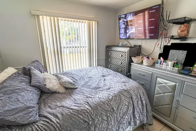 a bedroom with a bed and furniture