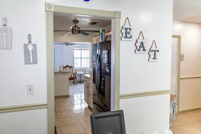 a view of a hallway with dining area