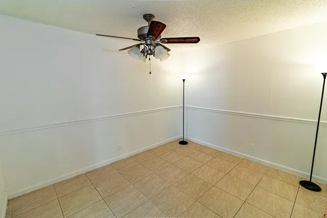 a view of a room with a fan