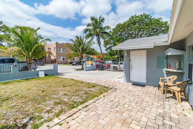 a view of a backyard with a patio