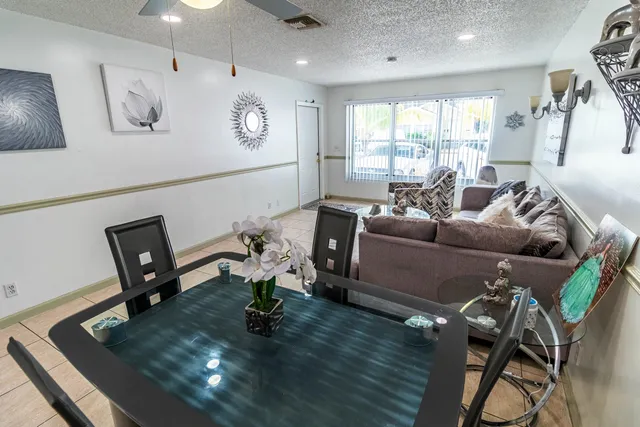 a living room with furniture window and wooden floor