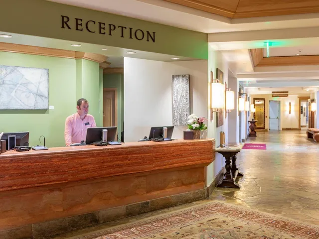 a bedroom with a bed and a table