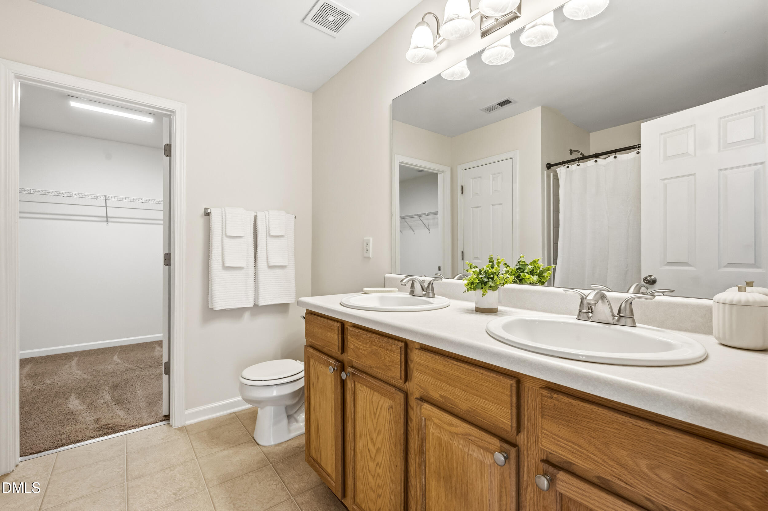 112 Ryder Cup Circle Raleigh, NC 27603 - Photo 24 of 45 a bathroom with a sink a toilet and shower