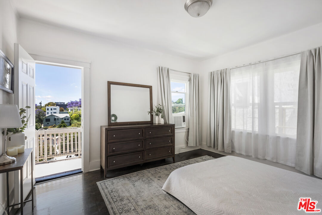 1120 West Edgeware Road Los Angeles, CA 90026 - Photo 13 of 32 a bedroom with a bed and a dresser