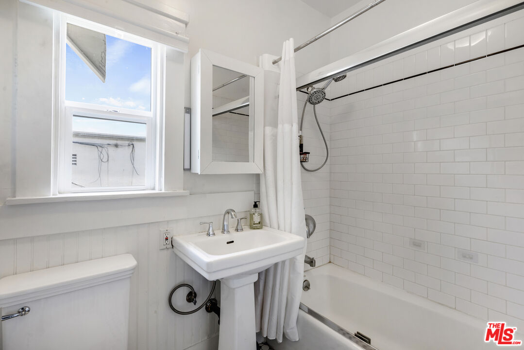 1120 West Edgeware Road Los Angeles, CA 90026 - Photo 15 of 32 a bathroom with a sink a toilet and shower