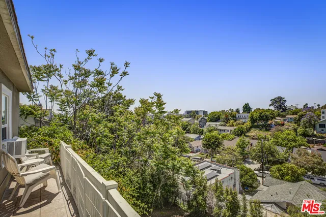 a view of a house with a flower garden
