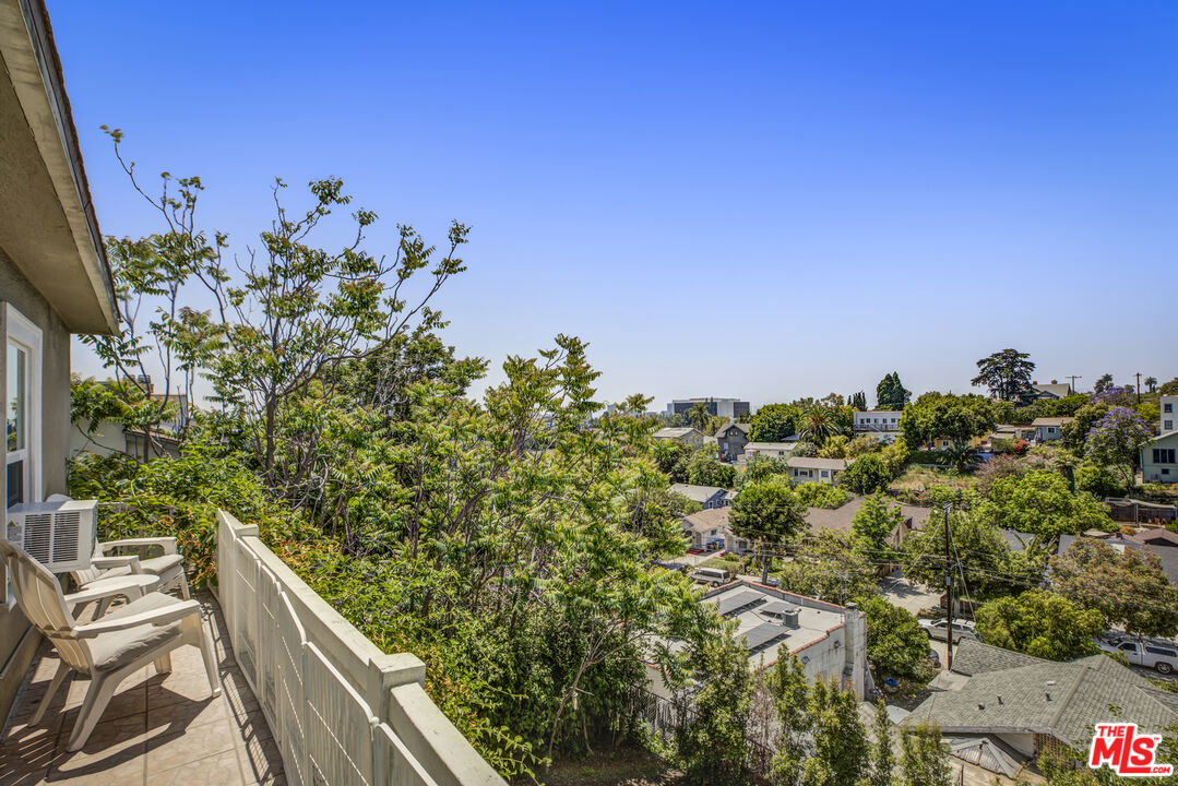 1120 West Edgeware Road Los Angeles, CA 90026 - Photo 17 of 32 a view of a house with a flower garden