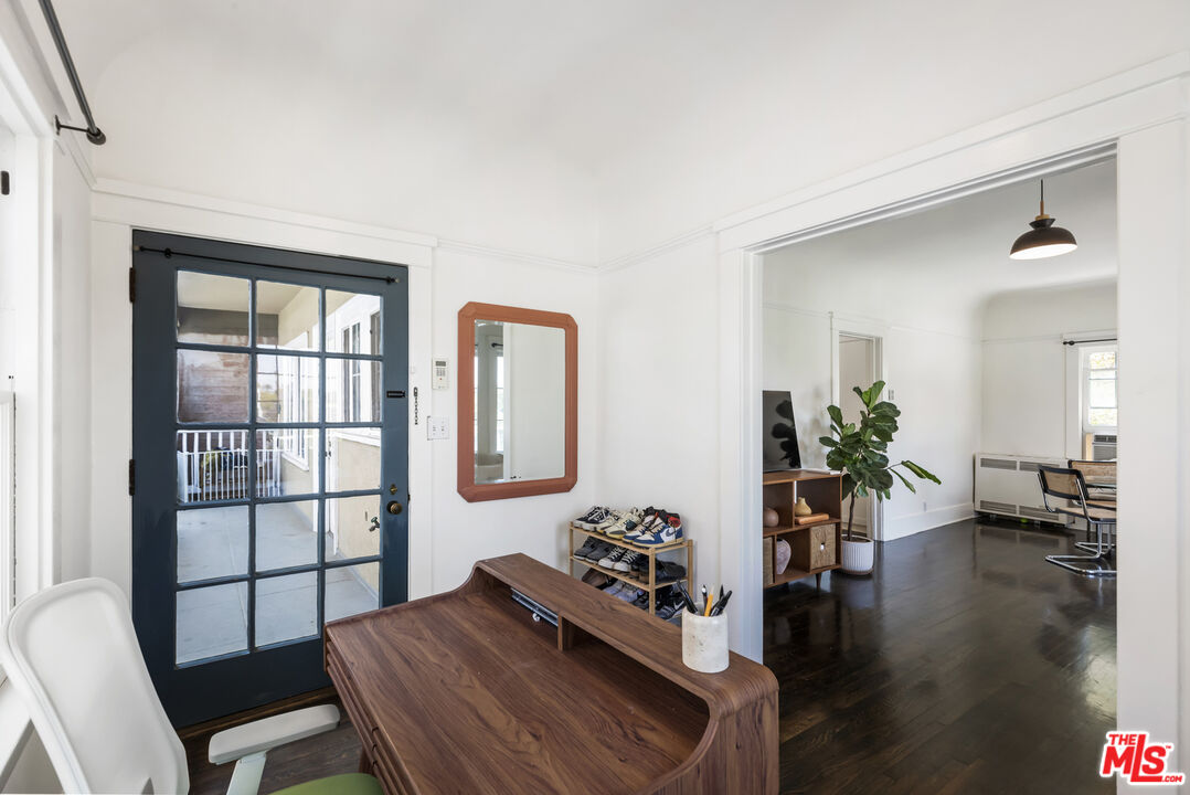 1120 West Edgeware Road Los Angeles, CA 90026 - Photo 19 of 32 a view of a dining room with furniture window and wooden floor