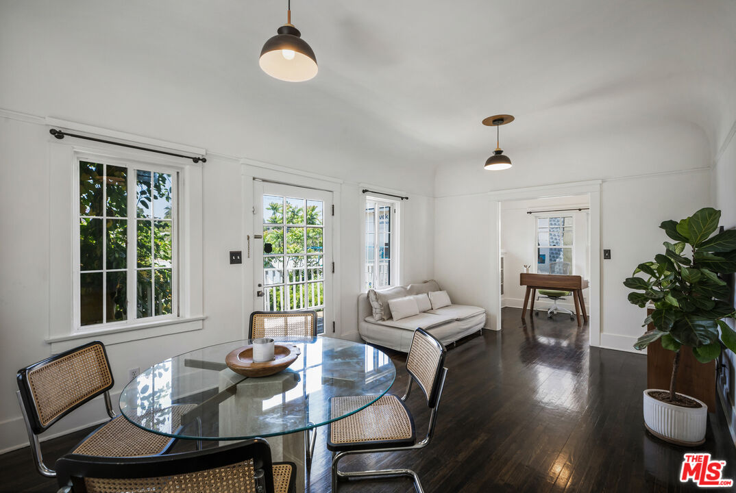 1120 West Edgeware Road Los Angeles, CA 90026 - Photo 21 of 32 a view of a dining room with furniture window and wooden floor