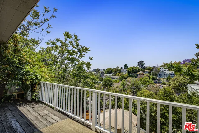 an aerial view of a house with outdoor space
