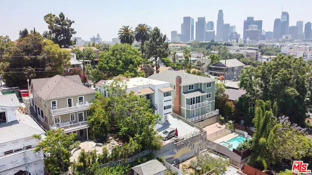 an aerial view of a house with a yard and garden