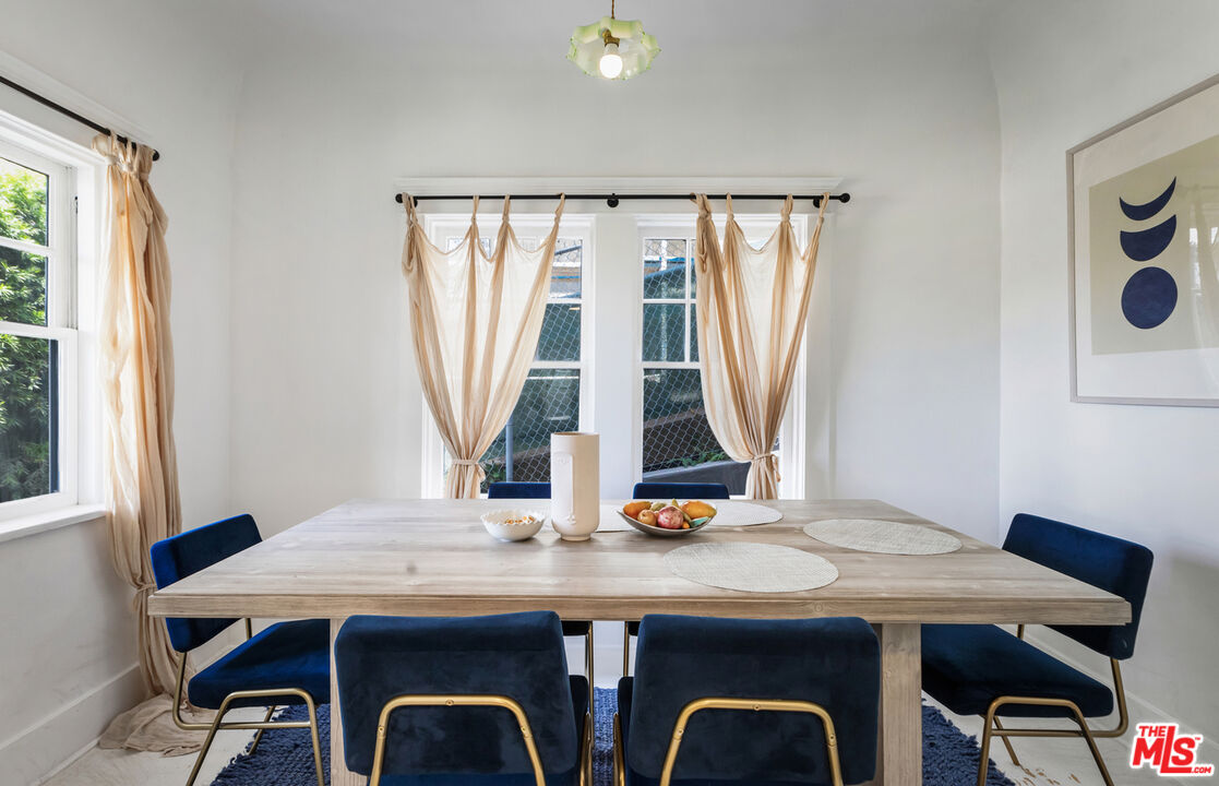 1120 West Edgeware Road Los Angeles, CA 90026 - Photo 5 of 32 a view of a dining room with furniture and window