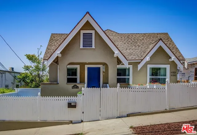 a front view of a house with a garage